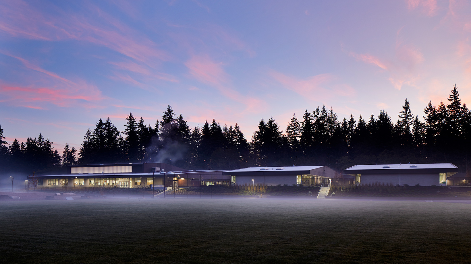 Madrona School at dawn with fog rolling by.